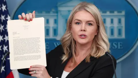 White House Press Secretary Karoline Leavitt shows a letter on tariffs from U.S. President Donald Trump to Japanese Prime Minister Shigeru Ishiba, during a press briefing at the White House in Washington, DC, US, 7 July, 2025.