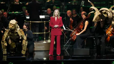 BBC Studios Kirsty Young on stage at the Royal Albert Hall for Sir David Attenborough's 100th birthday