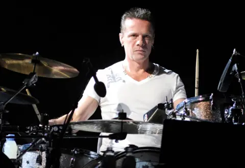 Getty Images Larry Mullen Jr plays the drums