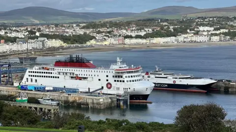 The Manxman and Manannan ferries moored in Douglas Harbour. Douglas Bay and the promenade can be seen in the background.