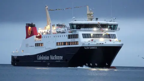 PA Media A black and white ship with red funnels. Caledonian MacBrayne is written on the side as is the ship's name Glen Sannox