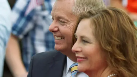 Graham and Nordone seen standing together and smiling