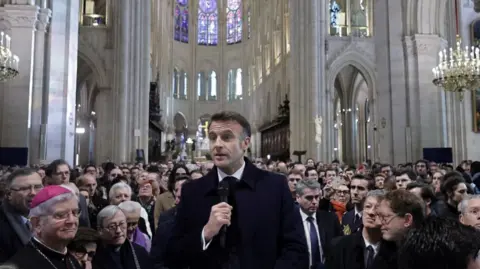 Reuters Macron speaks at Notre Dame