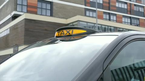 A black taxi with its light on