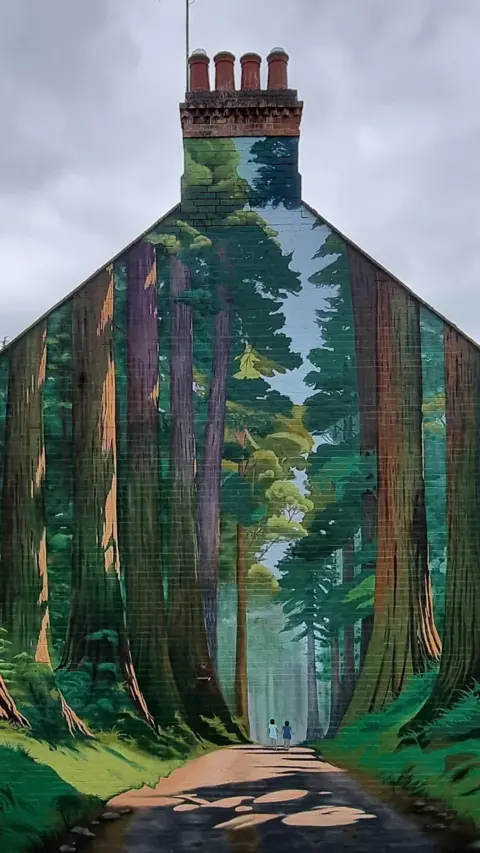 Brink Contemporary Arts Gable end of house with a forest mural