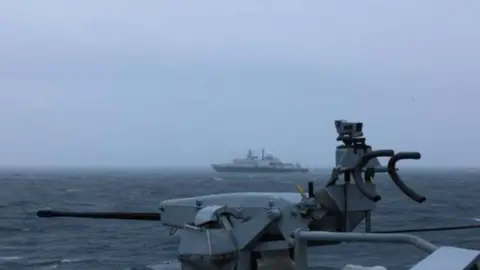 Ministry of Defence A Russian ship is being monitored from a distance
