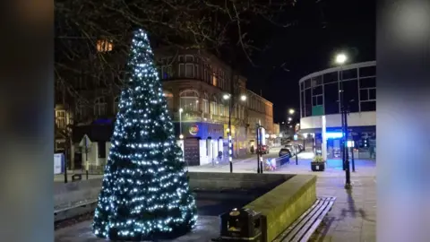 Unknown Morley's Christmas tree with lights all the way around.