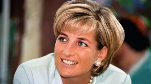 A picture of Diana in a light blue shirt