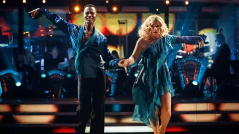 BBC/PA Wire BBC handout photo of Alex Kingston and Johannes Radebe during their appearance on the live show of Saturday's Strictly Come Dancing show on BBC1. Issue date: Saturday October 18, 2025