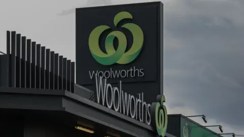 Woolworths signage outside one of its supermarkets in Melbourne, Australia.