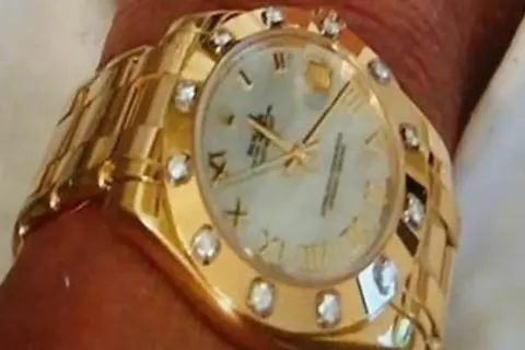 Met Police A gold Rolex watch with a diamond encrusted face