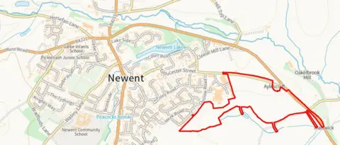 Robert Hitchins/FODDC An outline on a geographical map of the plans, with the area earmarked for development highlighted with a red border. 