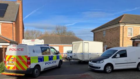 Police vans outside a property Ingleby Barwick