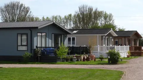 Shaun Whitmore/BBC A Suffolk holiday park where cabin homes can be rented out.