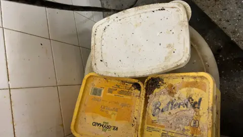 Central Bedfordshire Council Butter dishes covered in dirt