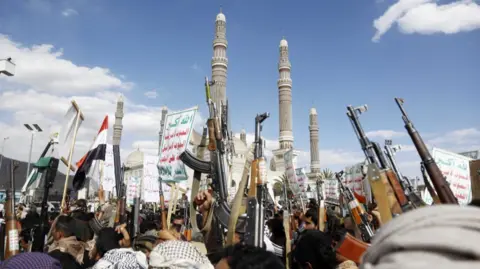 Getty Images Thousands gather in the Yemeni capital Sana'a, led by the Houthis, to protest against the attacks on the country, on 17 March 2025