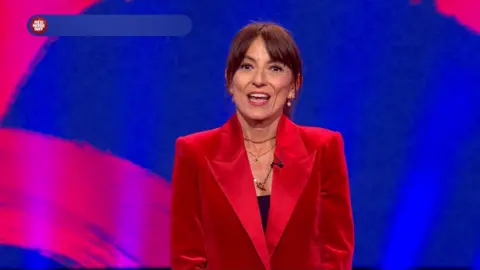 A teary-eyed Davina McCall in red velvet blazer 