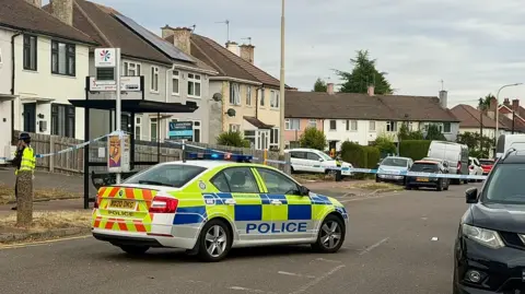 Leicester Media Online A police car next to a taped off street