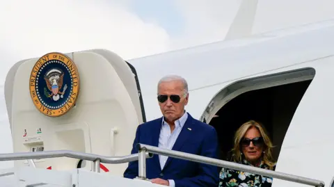 Reuters Biden and his wife exiting Air Force One