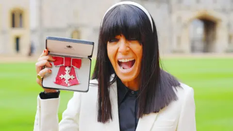 Claudia Winkleman after being made a Member of the Order of the British Empire by King Charles III during an Investiture ceremony at Windsor Castle, Berkshire. Picture date: Tuesday December 9, 2025.