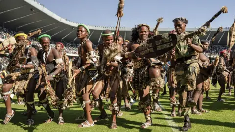 Getty Images Zulu warriors and also MK (uMkhonto WeSizwe) Party supporters gather at the party's People's Mandate Rally held at the Orlando Stadium, Soweto, Johannesburg, South Africa, 18 May 2024
