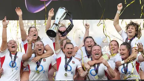 England's team celebrate winning the Six Nations