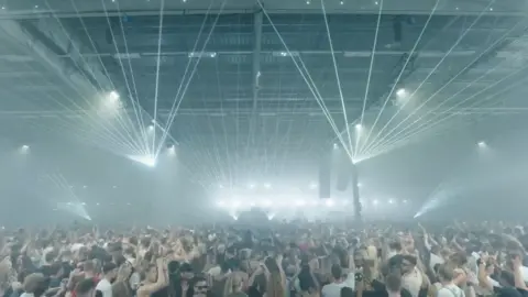 Broadwick Live people dancing at Drumsheds with lots of bright lights