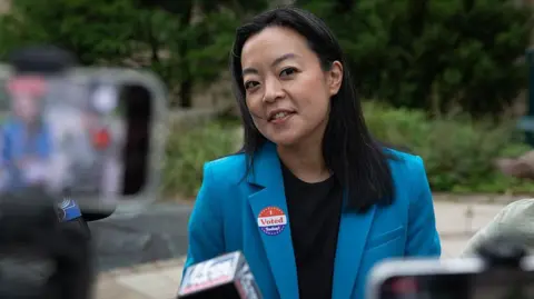 Getty Images Democratic Wisconsin governor candidate Francesca Hong speaks to reporters