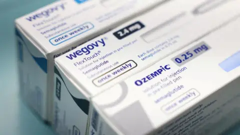 White boxes of Ozempic and Wegovy made by Novo Nordisk are seen at a pharmacy 