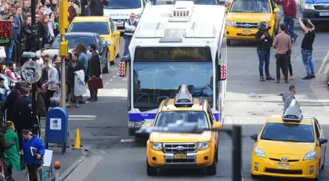 MEN Syndication Manchester's northern quarter with yellow taxis