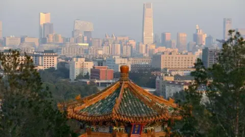 Getty Images The Beijing skyline bathed in sunshine pictured from a hillside