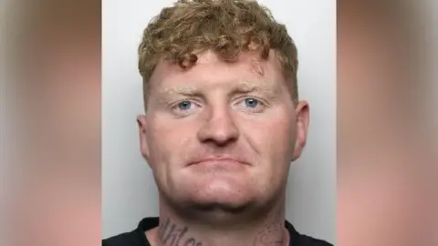 South Yorkshire Police A mugshot of Lewis Merritt