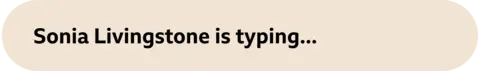 A beige container  that reads "Sonia Livingstone is typing..."