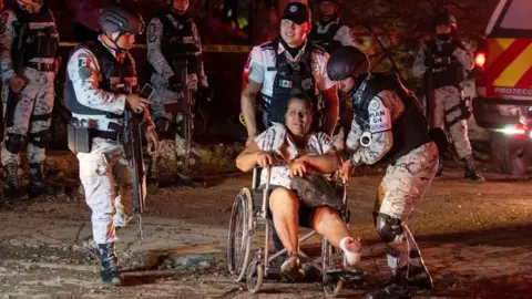 An injured person at the scene in Mexico