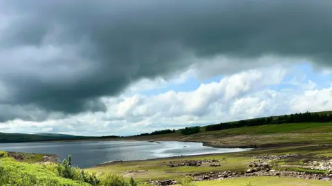 Clouds over a lake in Hebden, North Yorkshire