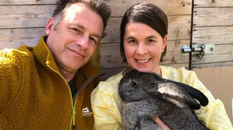 Chris Packham Chris Packham with his partner Charlotte Corney, who is holding a rabbit with big ears
