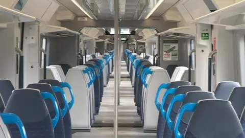 Interior view of an Arterio train, showing no doors between carriages