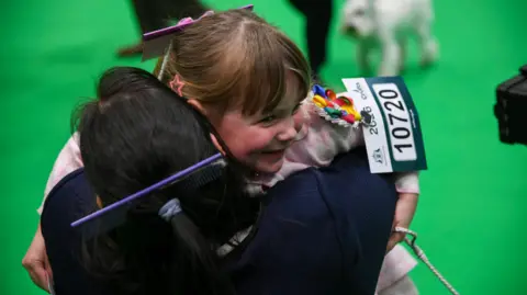 Lydia Mellor Mum and daughter embracing in a hug 