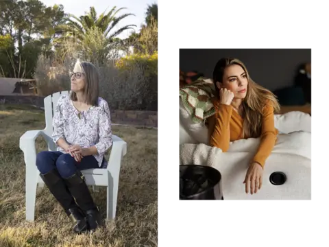 Danni Ackerman sits outside on a white garden chair. She is wearing blue jeans, black boots and a white blouse. She has brown hair and is wearing glasses.  Jordan Lux sits indoors on an armchair. She has long brown hair and is wearing a light brown, long sleeve top