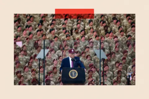 Getty Images US President Donald Trump addresses a crowd of servicemen and women 
