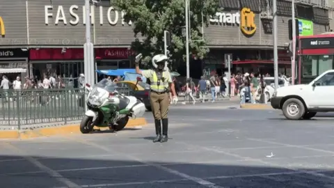 Reuters An officer directing traffic in Santiago