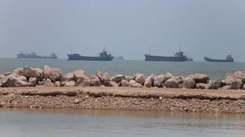 Ships in the distance on the coast line near Iran.