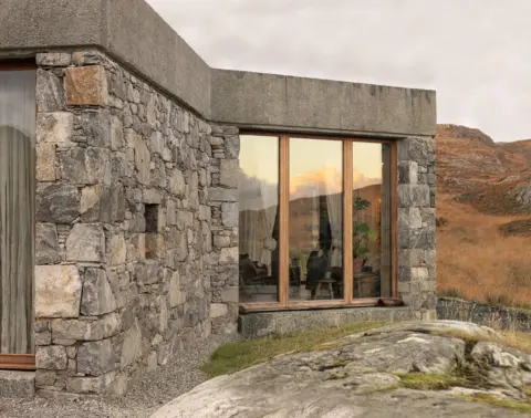 Richard Gaston Caoghan na Creige - a stone clad building with big windows