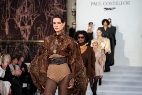 PA Media Models walk for William Costelloe at the Paul Costelloe show in the Palm Court at The Waldorf Aldwych, central London, during London Fashion Week