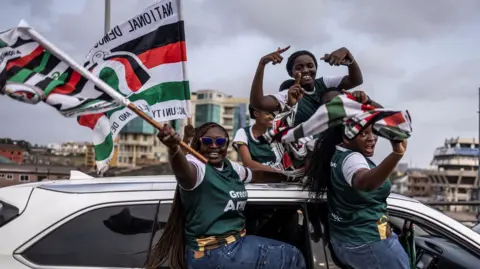 AFP Supporters of erstwhile  Ghana President and statesmanlike  campaigner  for the National Democratic Congress (NDC), John Mahama (unseen) emergence  flags of NDC governmental  enactment      connected  they suit   successful  a car   during an electoral caravan up  of statesmanlike  predetermination  of December 7, 2024, successful  Accra, connected  December 3, 2024. 