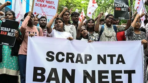 Getty Images Members of the Students' Federation of India protest against the National Testing Agency (NTA) after the cancellation of the NEET examination over an alleged paper leak, in Chennai on May 14, 2026.