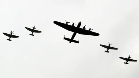 PA Media A silhouetted image of the Battle of Britain Memorial Flight 