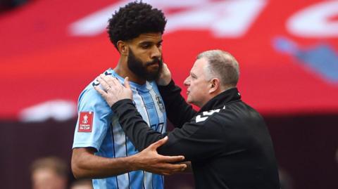 Mark Robins with Ellis Sims