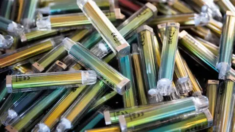 James Manning/PA Wire A pile of colourful disposable plastic vapes