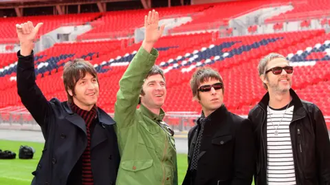 Getty Images Oasis the band pictured smiling in 2008